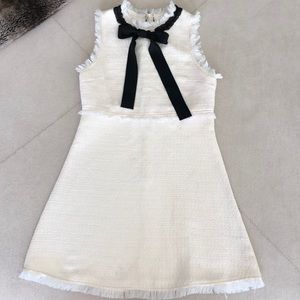 White dress with black sash collar bow